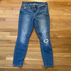 Lightly distressed blue skinny jeans from Gap